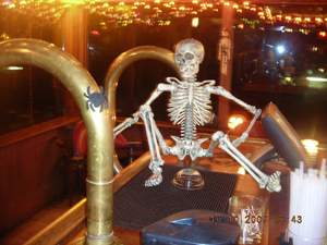 Skeleton sitting on the bar