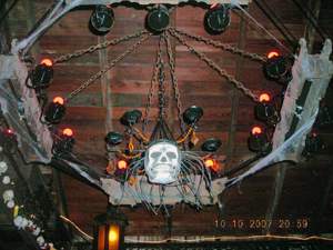 Chandelier with cobwebs and skeleton mask