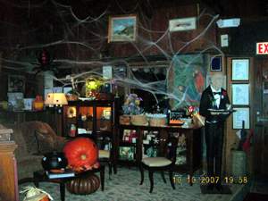 Decorated waiting area with pumpkins and cobwebs