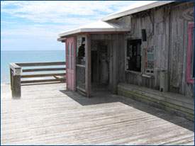 Exterior built with pecky cypress and decorated with doors